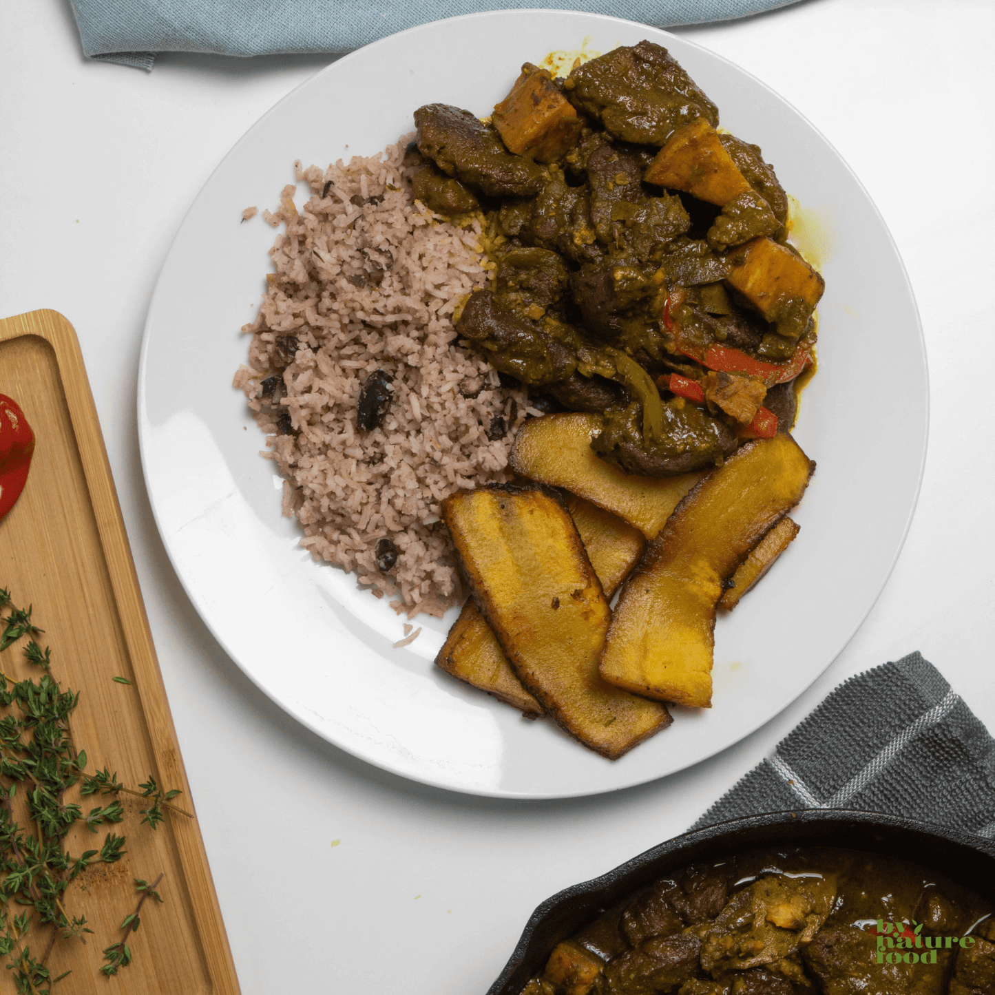 Spicy and flavorful Caribbean inspired Vegan Curry Goat served with rice and plantains